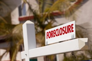Foreclosure Sign in Front of House.