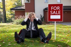 For Sale Sign in Front of House
