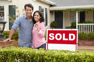 Sold Sign in front of House